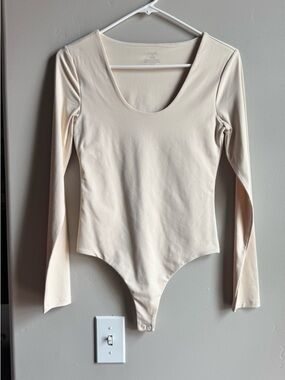 NUUDS Nude Long Sleeve Bodysuit Minimalist Neutral Clean Girl Fitted Top Scandi